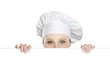 Photo: Female chef looking over billboard Female chef looking over billboard