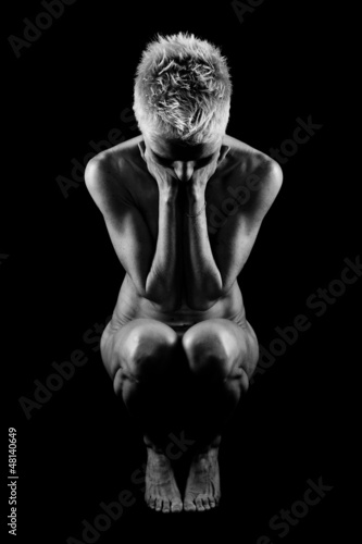 Photo: Naked woman on black background Naked woman on black background