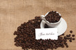 Cup of coffee beans with white card for text