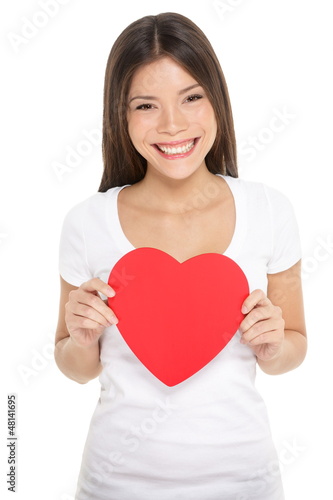Photo: Valentines day woman holding heart isolated Valentines day woman holding heart isolated