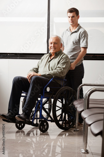 Photo: Man With Grandfather Sitting In Wheelchair Man With Grandfather Sitting In Wheelchair