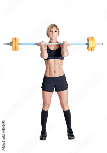 Photo: strong young woman with barbell isolated strong young woman with barbell isolated