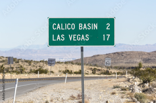 Photo: Las Vegas Road Sign with Las Vegas Valley in background Las Vegas Road Sign with Las Vegas Valley in background
