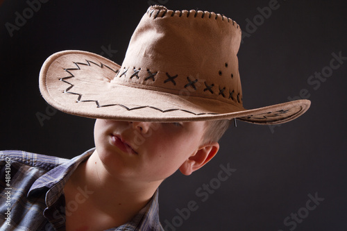 Photo: portrait of a boy in a cowboy hat portrait of a boy in a cowboy hat