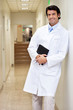 Happy Male Doctor Holding Book
