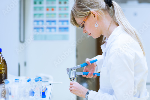 Photo: Female researcher carrying out research experiments Female researcher carrying out research experiments