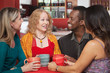 Joyful Group of Four in Cafe