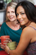 Sexy Hispanic Woman and Friend in Cafe