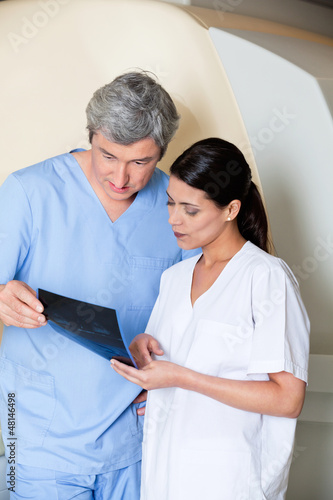 Photo: Technicians Looking At X-ray Technicians Looking At X-ray