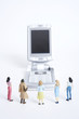 Female figurines looking at mobile phone