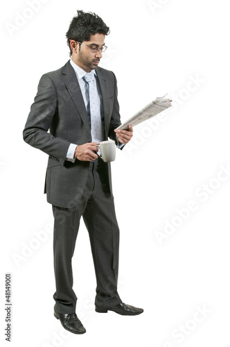 Photo: Man Drinking Coffee with Newspaper Man Drinking Coffee with Newspaper