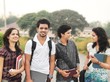 Group of Indian / Asian college students in the campus ground.