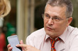 Businessman pointing on his smart phone