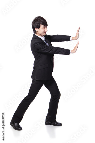 Photo: business man happy pushing business man happy pushing