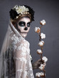 Beautiful woman in skull makeup