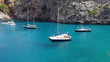 Yachts in beautiful bay with crystal clear green water