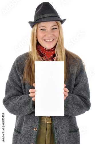 Photo: Junge Frau in bayrischer Kleidung hält leeres Schild Junge Frau in bayrischer Kleidung hält leeres Schild