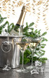 two glasses of champagne and golden streamer