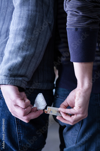 Photo: Hands Exchanging Cocaine with Money Hands Exchanging Cocaine with Money
