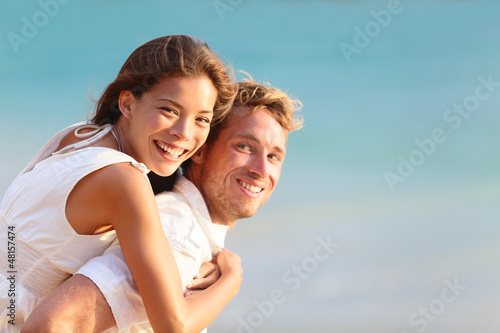 Photo: Multiracial people: Happy couple piggyback Multiracial people: Happy couple piggyback