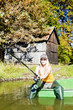 fishing woman sitting on boat