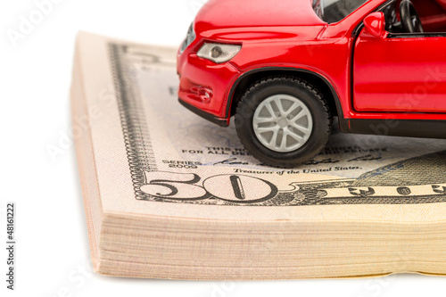 Photo: Auto auf Dollar Geldscheinen Auto auf Dollar Geldscheinen