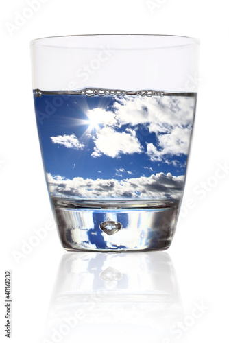 Photo: Glass of life. Cloudy sky in a glass of water Glass of life. Cloudy sky in a glass of water