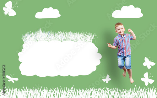 Photo: boy jumping on the background of painted wall boy jumping on the background of painted wall