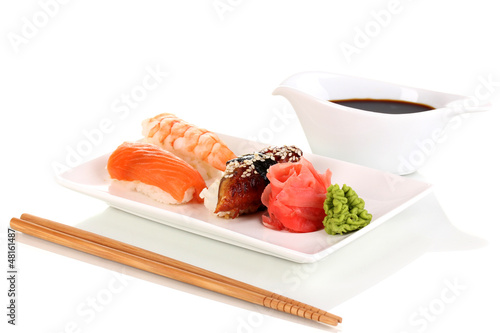 Photo: delicious sushi served on plate isolated on white delicious sushi served on plate isolated on white