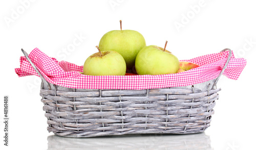 Photo: Ripe apples in basket isolated on white Ripe apples in basket isolated on white