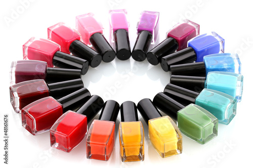 Photo: Group of bright nail polishes isolated on white Group of bright nail polishes isolated on white