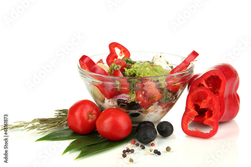 Photo: Fresh greek salad in glass bowl isolated on white Fresh greek salad in glass bowl isolated on white