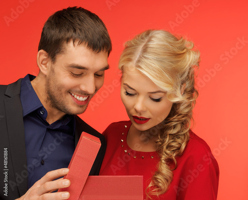 Photo: man and woman looking inside the gift box man and woman looking inside the gift box
