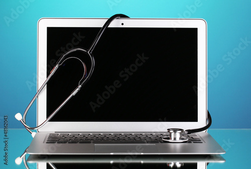 Photo: Silver notebook with a stethoscope Silver notebook with a stethoscope