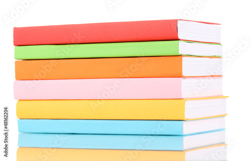 Photo: Stack of multicolor books isolated on white Stack of multicolor books isolated on white