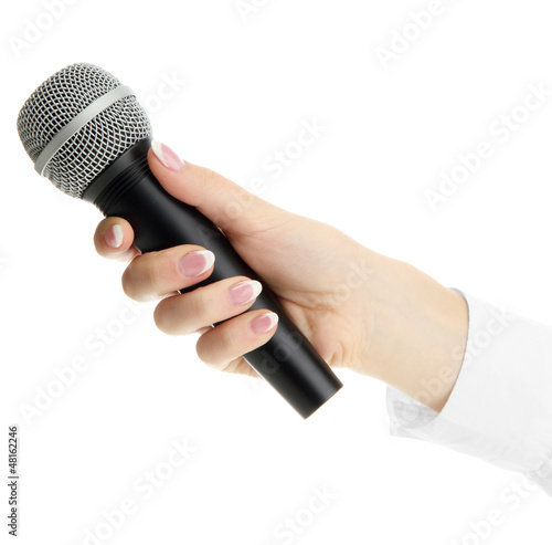 Photo: female hand with microphone isolated on white female hand with microphone isolated on white