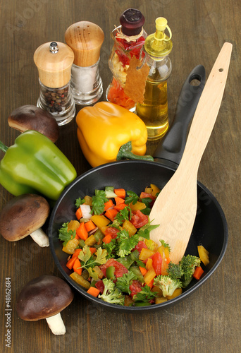 Photo: Sliced fresh vegetables in pan with spices and ingredients Sliced fresh vegetables in pan with spices and ingredients