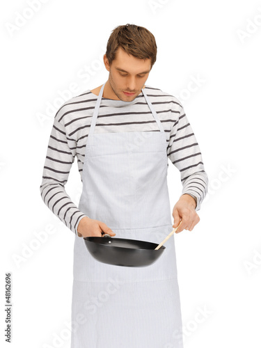 Photo: handsome man with pan and spoon handsome man with pan and spoon