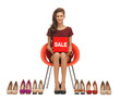teenage girl in red dress with shoes and sale sign
