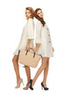 two teenage girls in white coats with bag