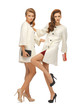 two teenage girls in white coats with clutches