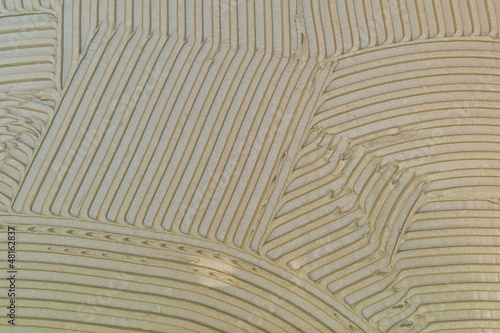 Photo: Fliesenkleber auf einer Wand Fliesenkleber auf einer Wand