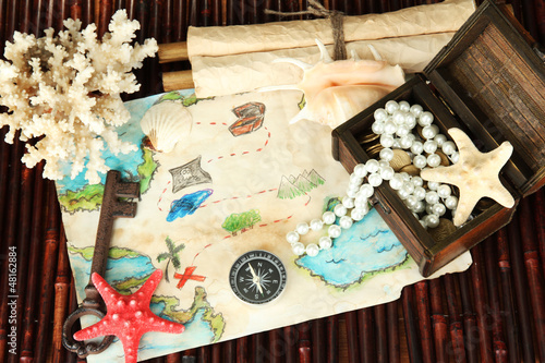 Photo: map of treasures on dark wooden background map of treasures on dark wooden background