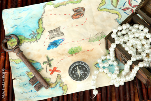 Photo: map of treasures on dark wooden background map of treasures on dark wooden background