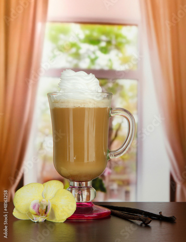 Photo: Fragrant coffee latte in glass cup with vanilla pods, Fragrant coffee latte in glass cup with vanilla pods,