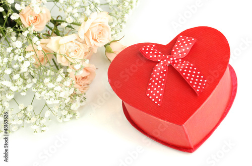 Photo: Giftbox and flowers isolated on white Giftbox and flowers isolated on white