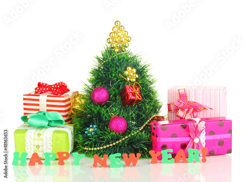 Photo: Decorated artificial Christmas Tree isolated on white Decorated artificial Christmas Tree isolated on white
