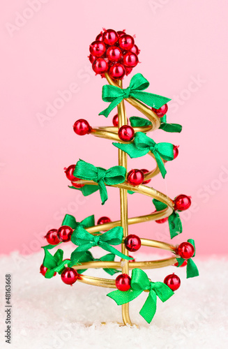 Photo: Wire Christmas tree on pink background Wire Christmas tree on pink background