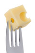 emmental cheese on fork against white background