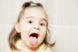 Little girl hanging tongue out